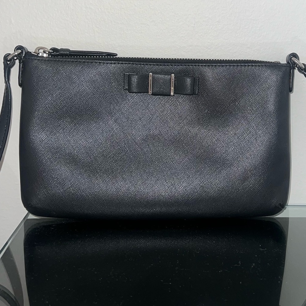 Coach Leather Crossbody Bag with Adjustable Strap and Bow Detailing